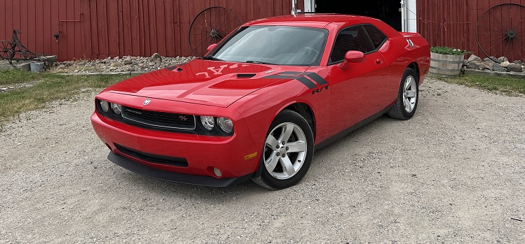 Red Dodge Challenger Red Dodge Challenger in front of barn